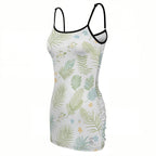 White tropical leaf print dress with black trim straps, angled product view