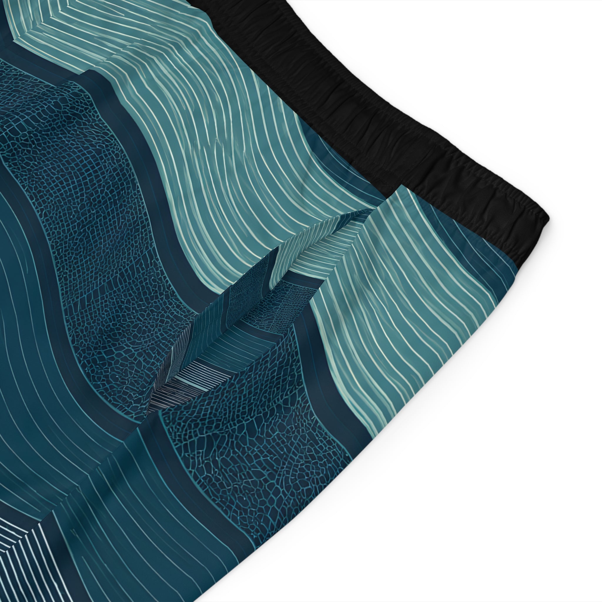 Close-up detail of the board shorts' wave pattern and elastic waistband