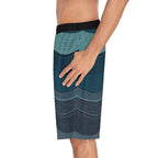 Man wearing SparkyCA wave-print board shorts, side view close-up