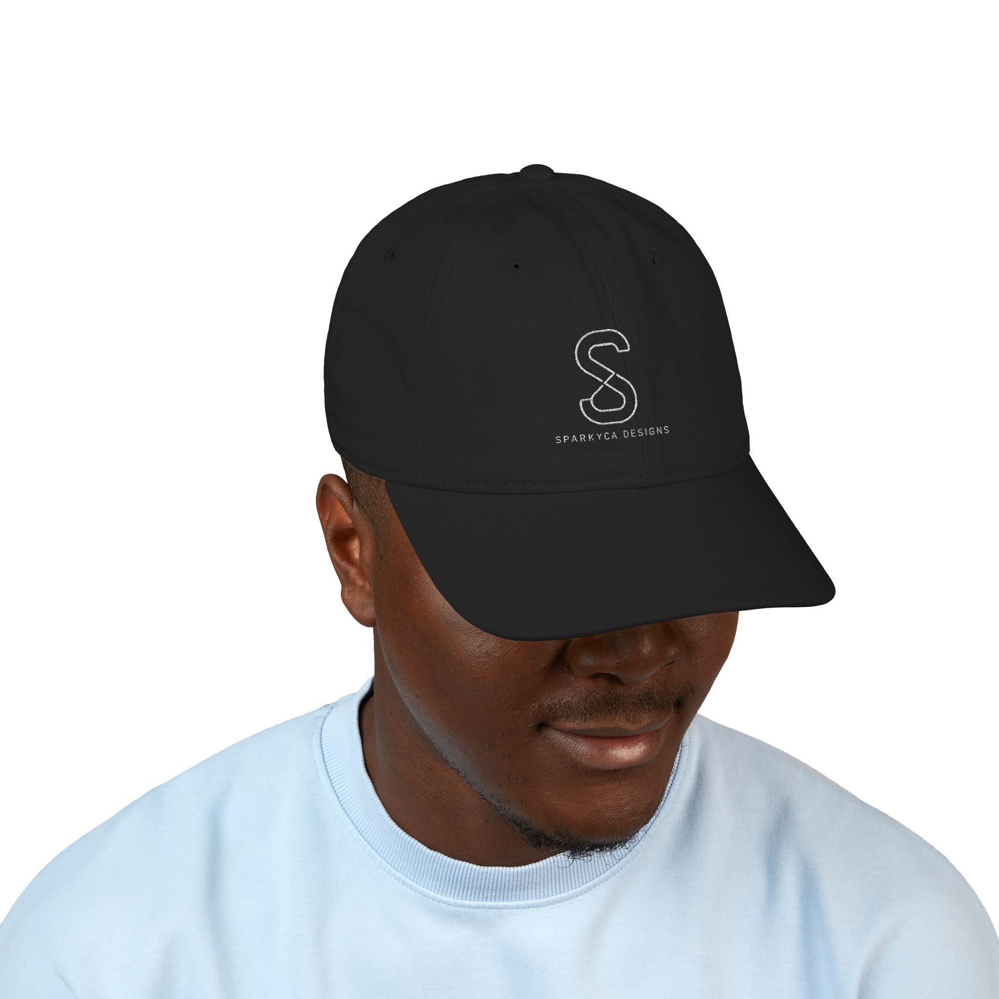Man wearing the Organic Embroidered Baseball Cap in Black, studio photo
