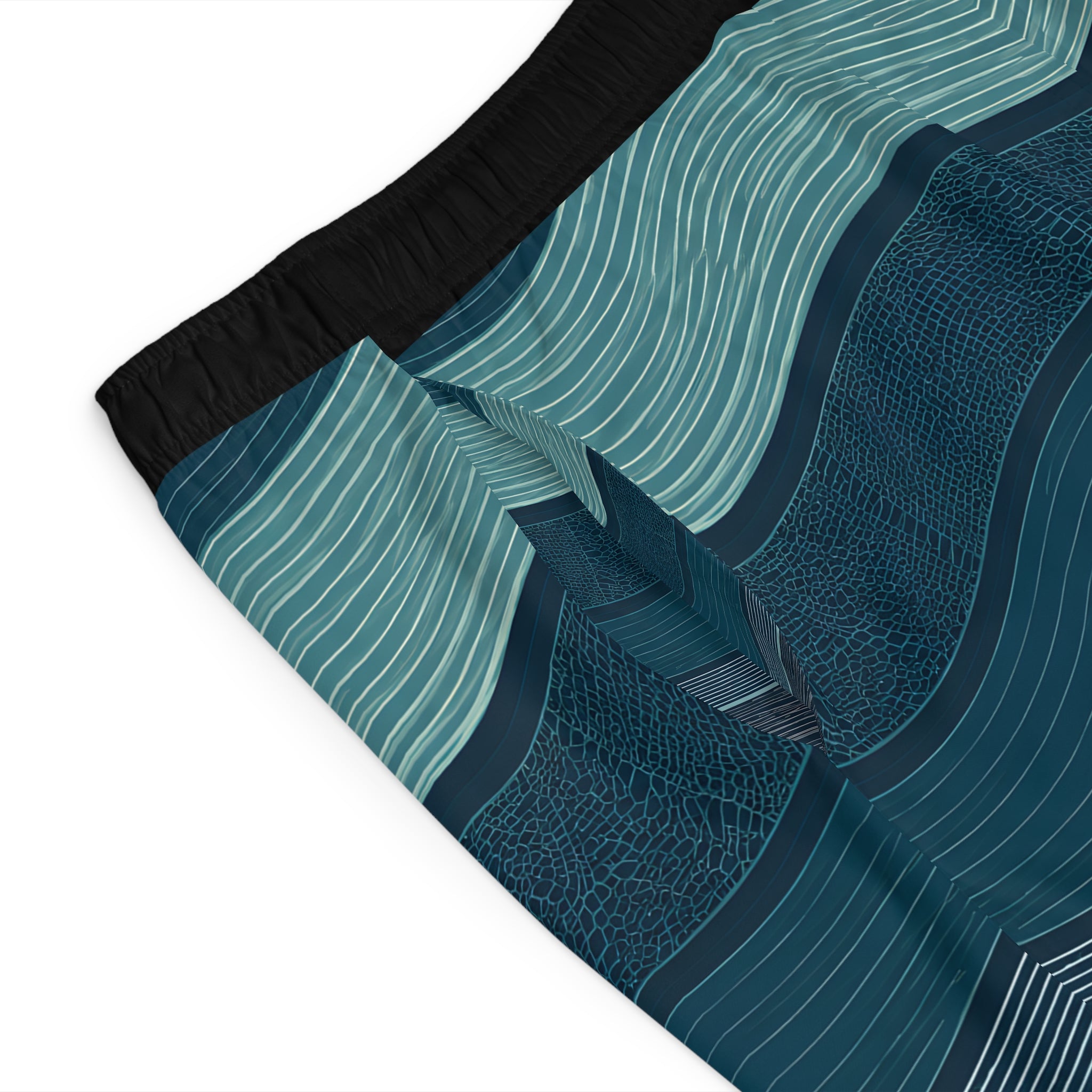 Close-up of the wave-print board shorts fabric showing the layered stripe and texture detail