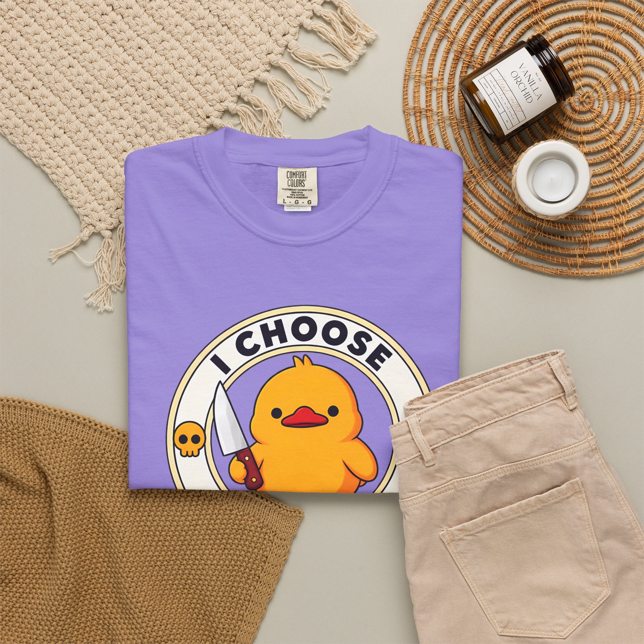 I Choose Violence Duck Tee in Violet — styled flat lay with props