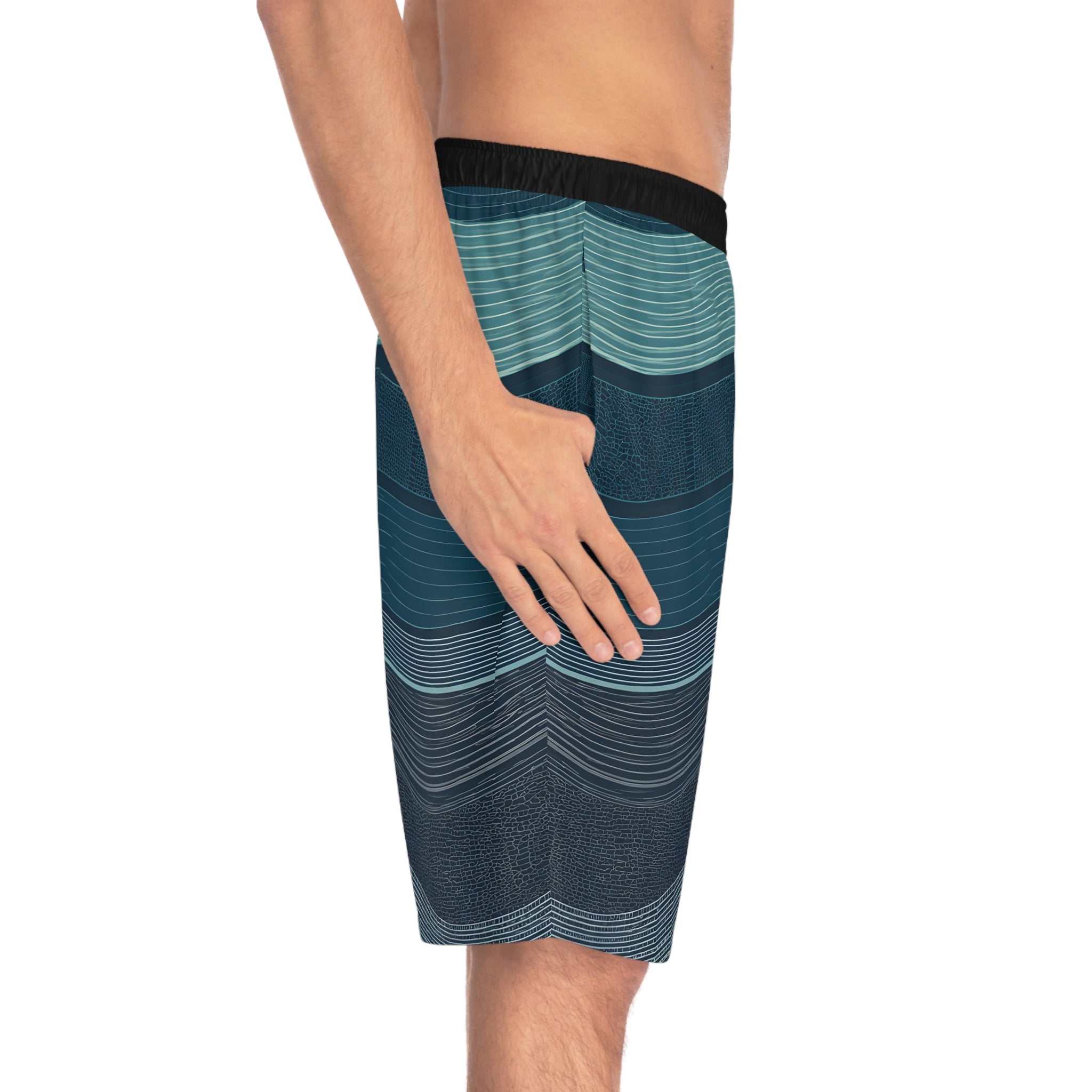 Man wearing SparkyCA wave-print board shorts, side view from hip to knee
