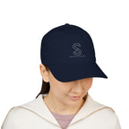 Woman wearing the Organic Embroidered Baseball Cap in Pacific navy, studio photo