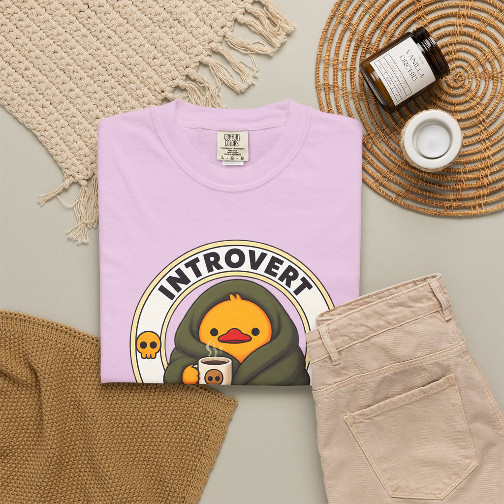 Introvert Duck Tee in Orchid — styled flat lay with props