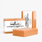 Three bars of ASUVO Kojic Acid & Turmeric Soap, two wrapped and one unwrapped