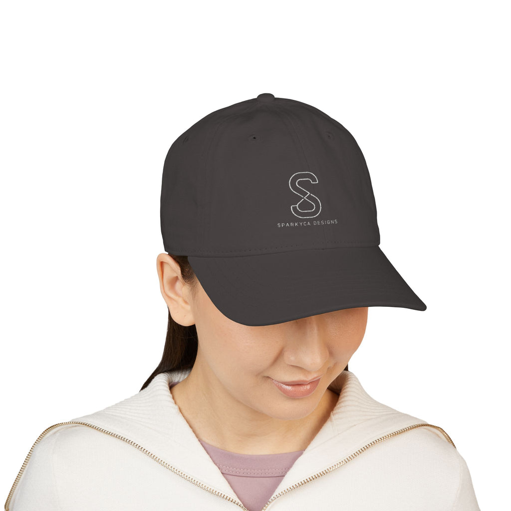 Woman wearing the Organic Embroidered Baseball Cap in Charcoal, studio photo