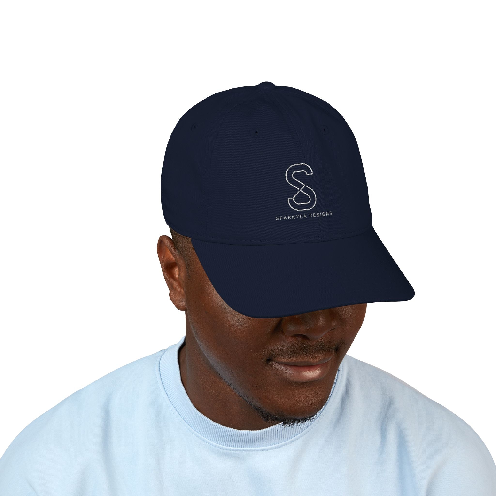 Man wearing the Organic Embroidered Baseball Cap in Pacific navy, studio photo