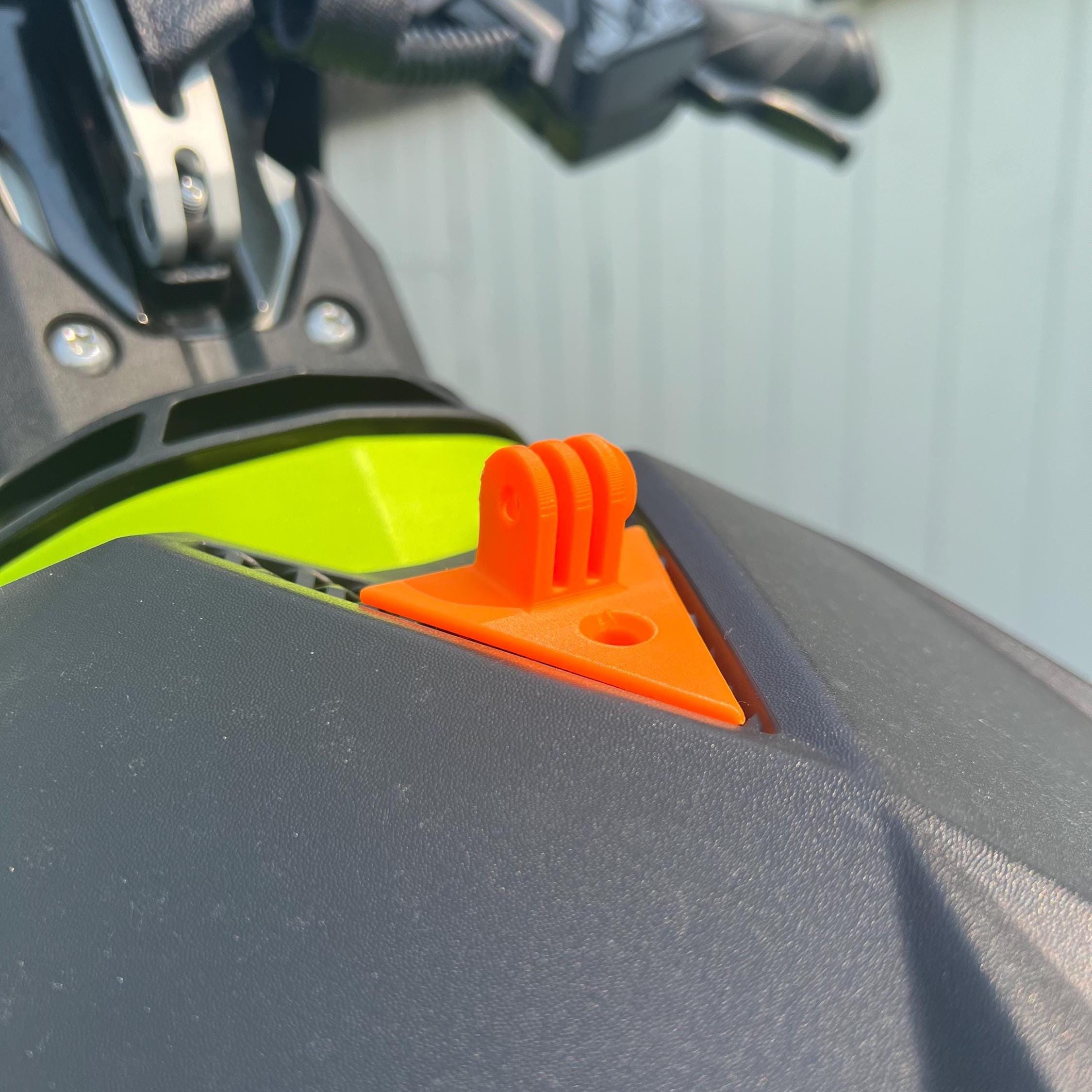 Orange GoPro mount installed on a Sea-Doo Spark's front grille next to the headlight