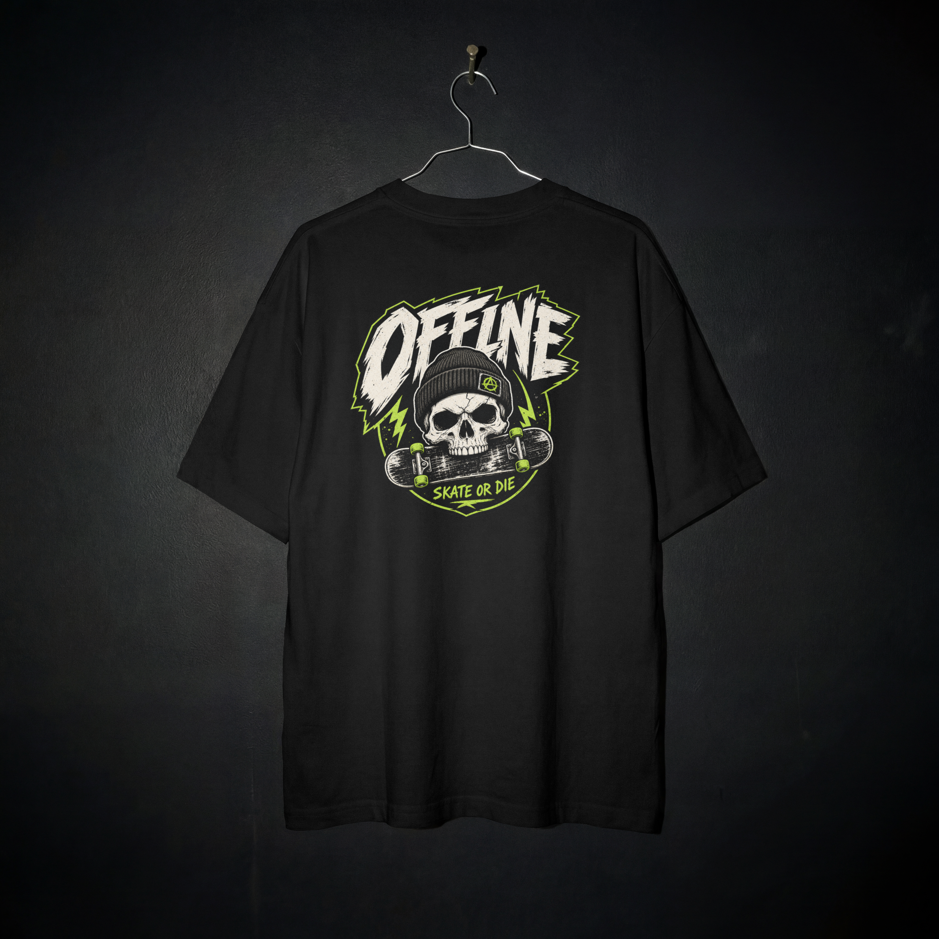 Black Offline Skate or Die graphic tee on a hanger, showing the matching skull-and-skateboard print on the back.