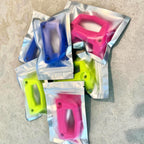 Sealed packaging bags of LinQ brackets in assorted colors