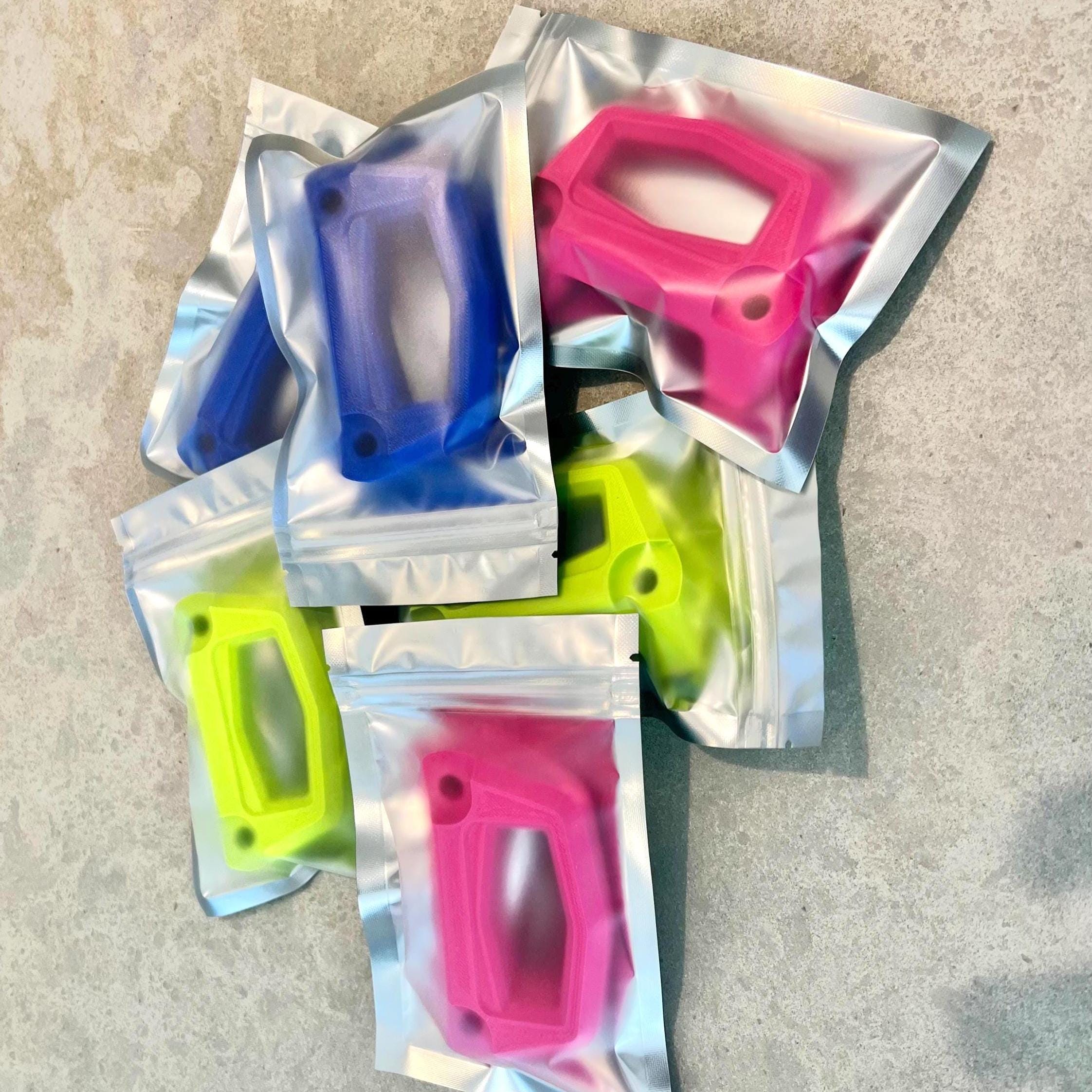 Sealed packaging bags of LinQ brackets in assorted colors