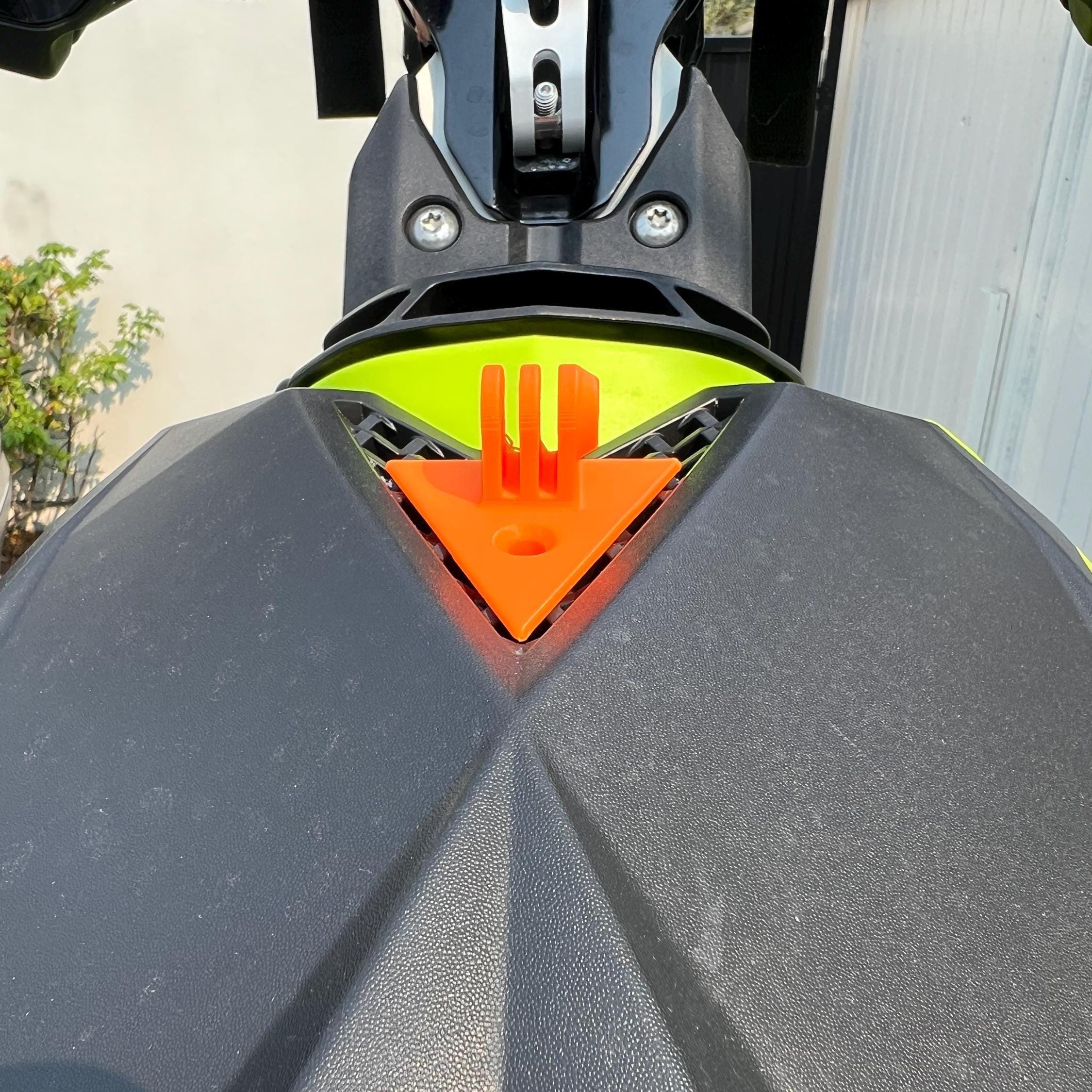 Close-up of orange GoPro mount bolted to a Sea-Doo Spark's dashboard vent