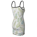 White tropical leaf print dress with black trim straps, back angled product view