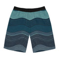 SparkyCA wave-print board shorts, flat lay view showing the layered teal wave pattern
