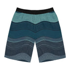 SparkyCA wave-print board shorts, flat lay view showing the layered teal wave pattern