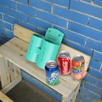 Teal Sea-Doo Spark Trixx cup holder displayed with soda cans for scale