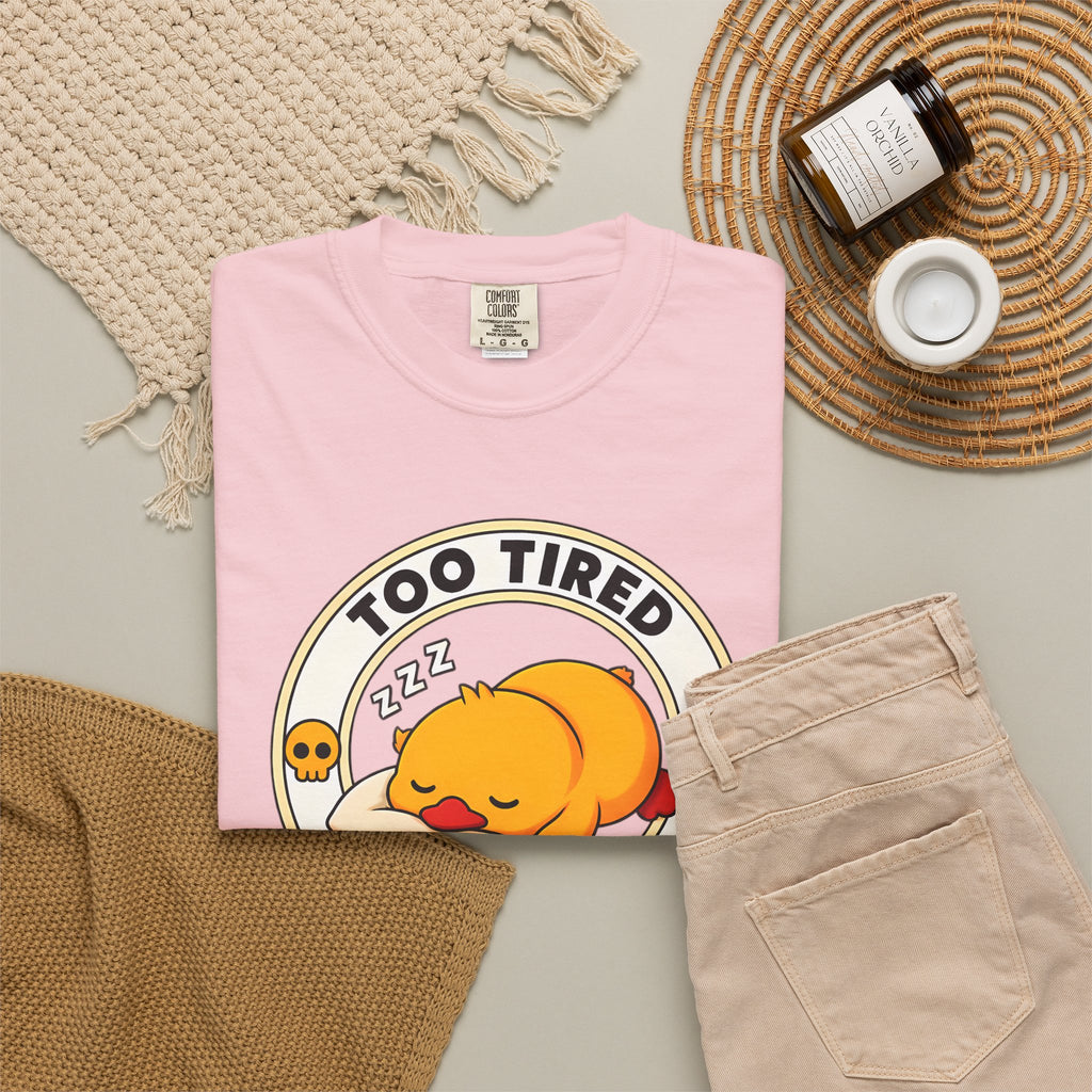 Too Tired Duck Tee in Blossom — styled flat lay with props