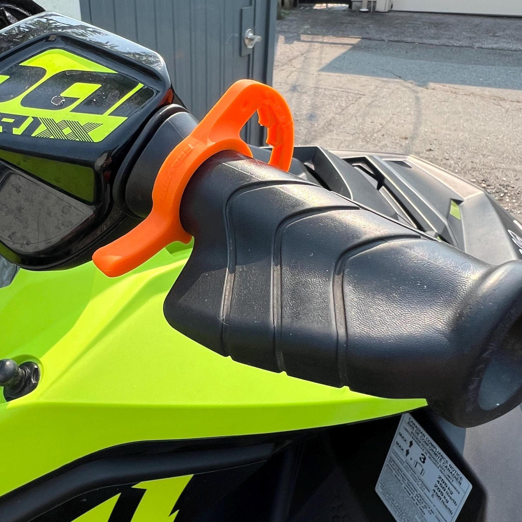 Orange cruise control lever on a Sea-Doo Spark Trixx handlebar