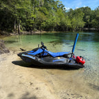 Sea-Doo Spark parked on a sandy shoreline with the flag pole and mount installed at the rear, gas can and US flag attached