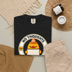 No Thoughts Head Empty Duck Tee in Black — styled flat lay with jeans and candle
