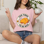Woman wearing the Too Tired Duck Tee in Blossom, lifestyle photo holding a mug