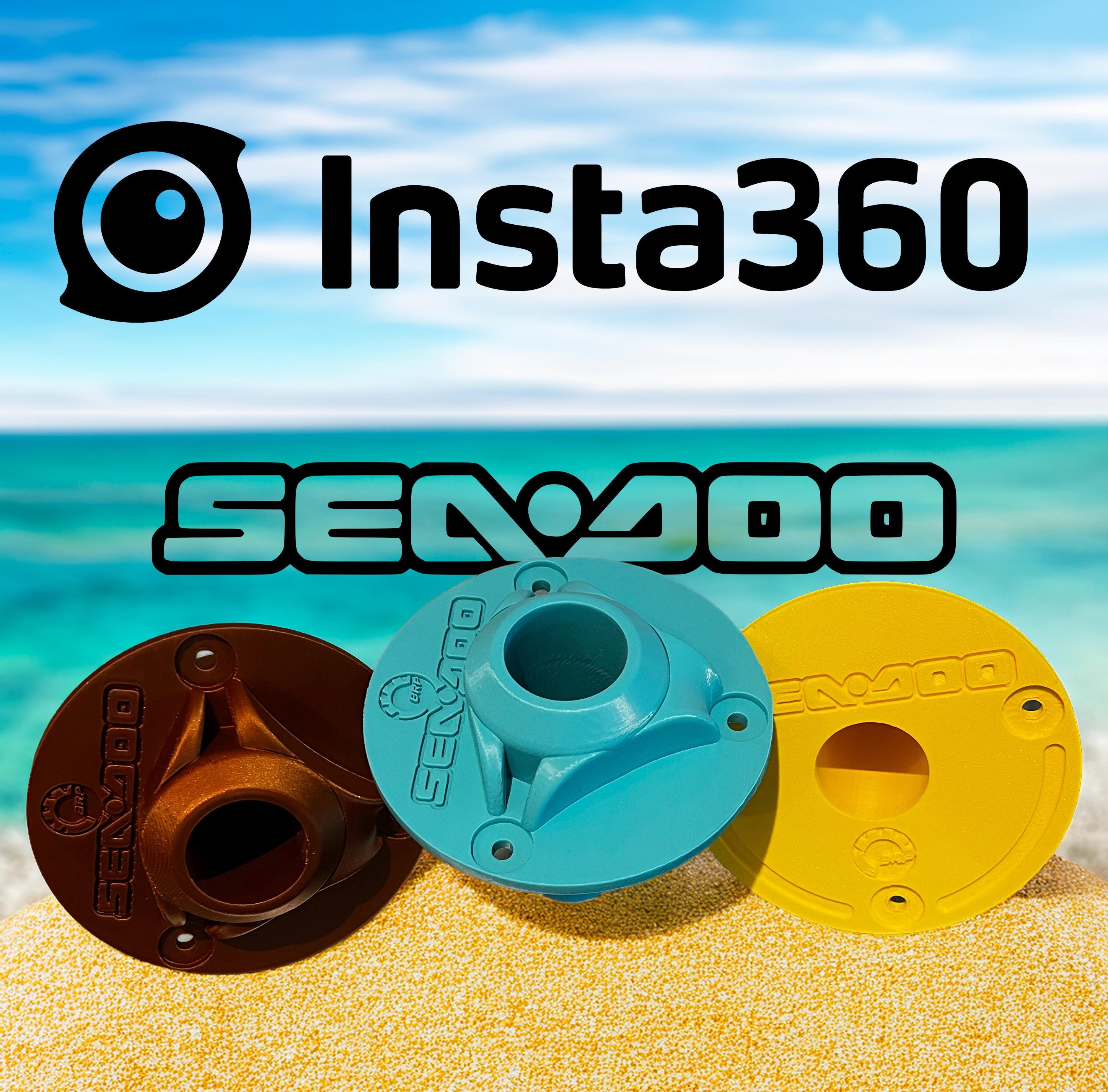 Three 3D-printed Sea-Doo pole mounts in bronze, teal, and yellow, displayed on a beach