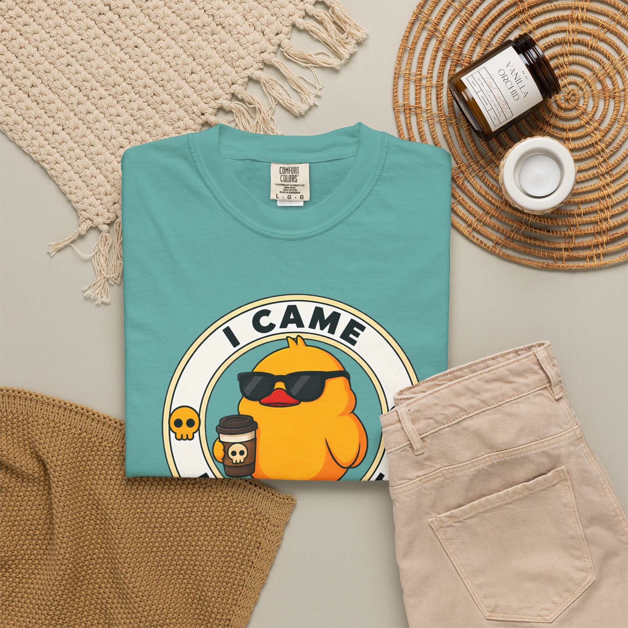 I Came, I Saw, I Hate It Duck Tee in Seafoam — styled flat lay with jeans and candle