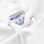 Close-up of the Champion Eco Authentic label and hood drawstring grommets