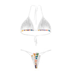 White-trim bikini set with colorful patchwork print, back view laid flat