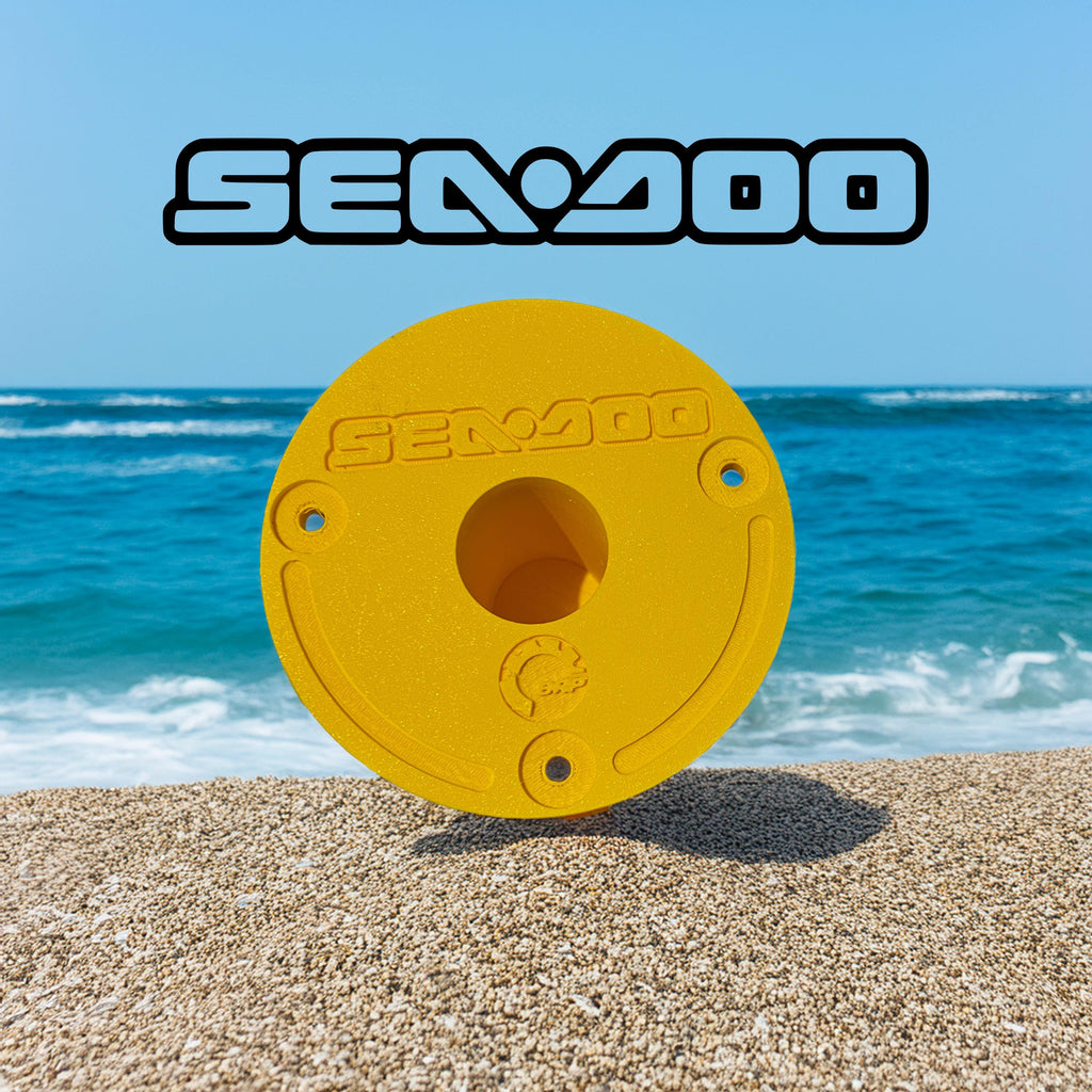 Yellow Sea-Doo Insta360 pole mount standing upright on a beach with ocean in the background