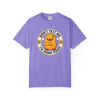 Dont Test Me Duck Tee in Violet — front flat lay with graphic print