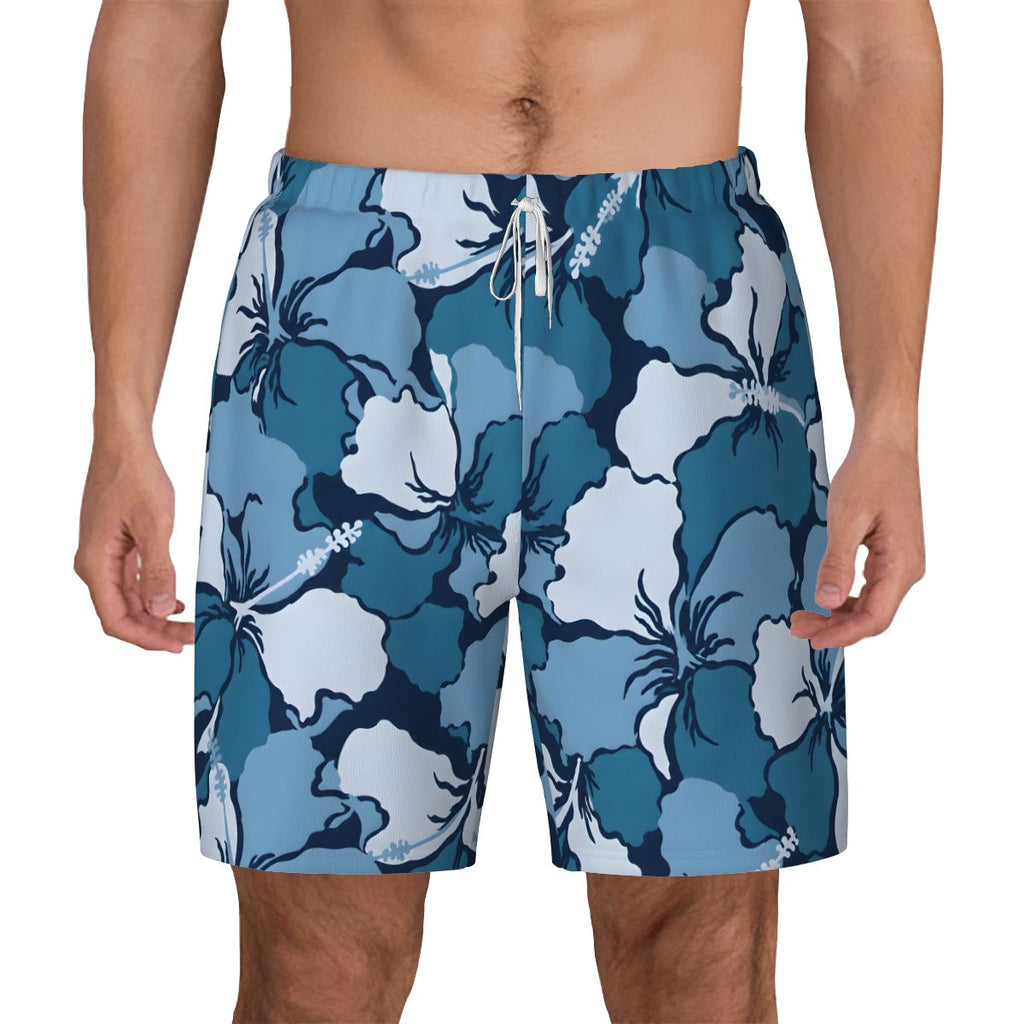 Blue and white hibiscus print swim shorts, front view close-up on model