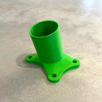 3D-printed flag/camera mount in green plastic, standalone photo on a countertop