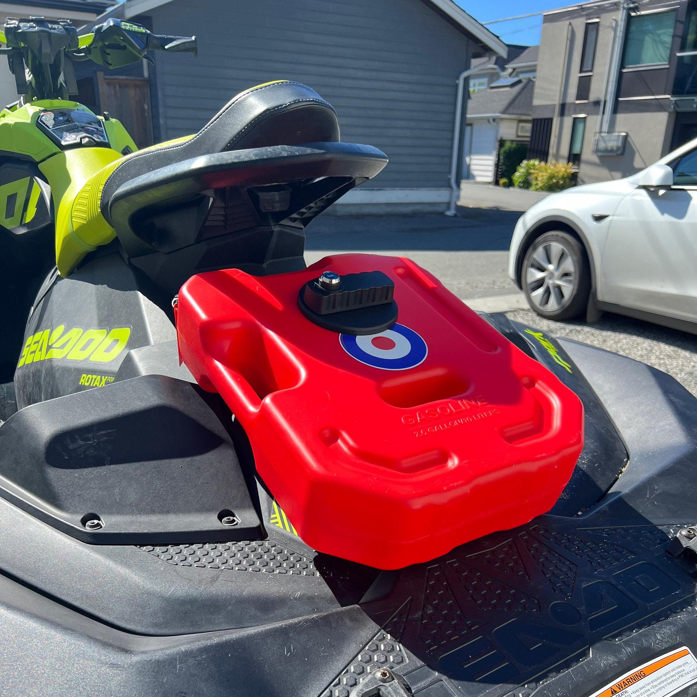 Red fuel can mounted on a Sea-Doo Spark using the 3D-printed bracket, parked outside a house