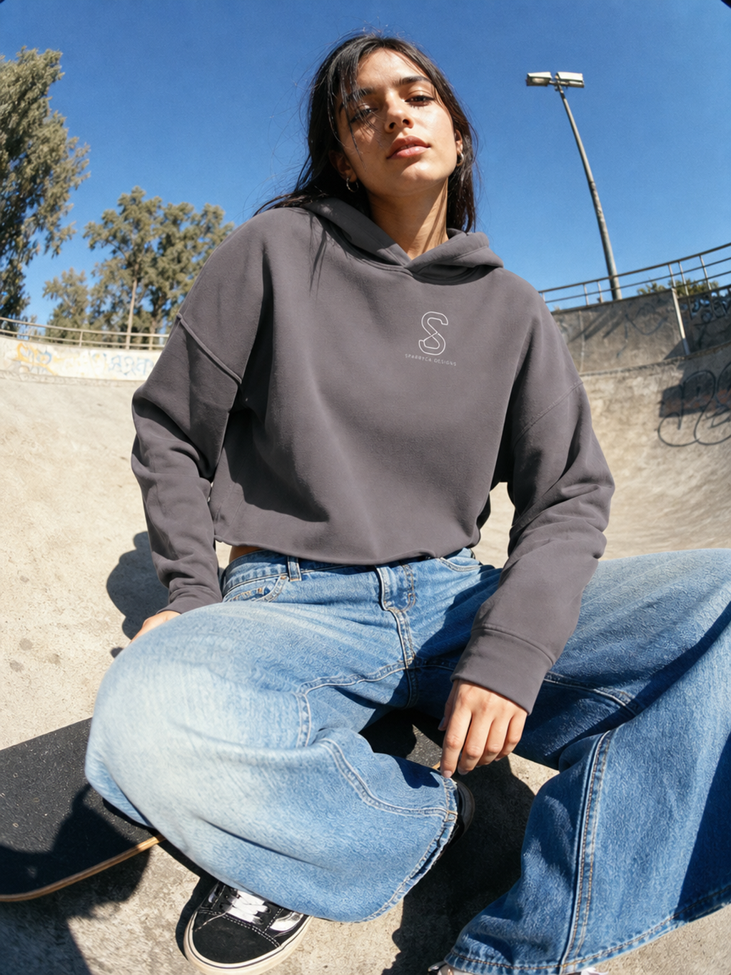 Woman wearing the Women's Cropped Hoodie in Storm grey, skate park lifestyle photo