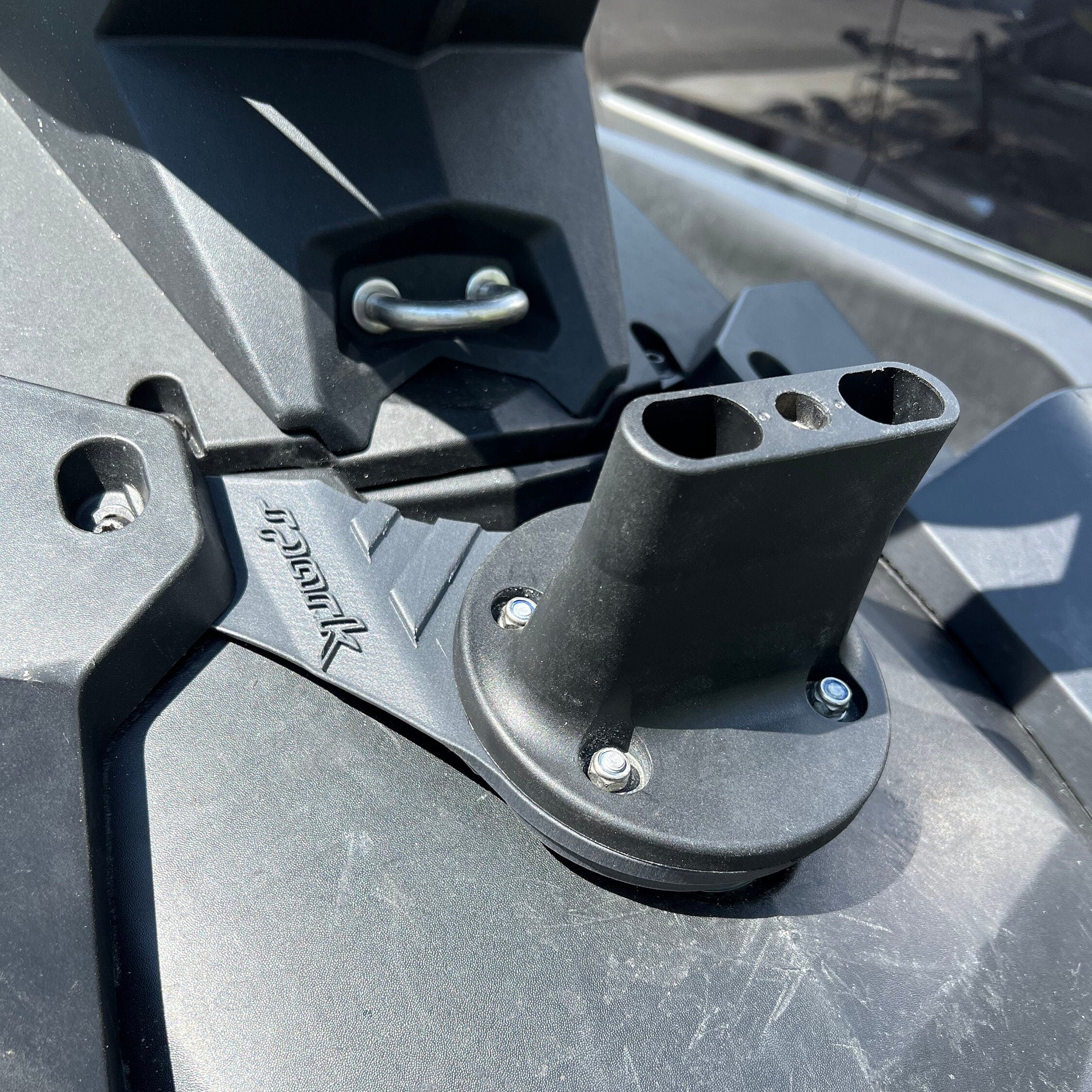 Close-up of the gas can bracket mount bolted to a Sea-Doo Spark deck