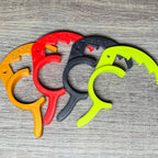 Four Sea-Doo cruise control levers in gold, red, black, and lime green