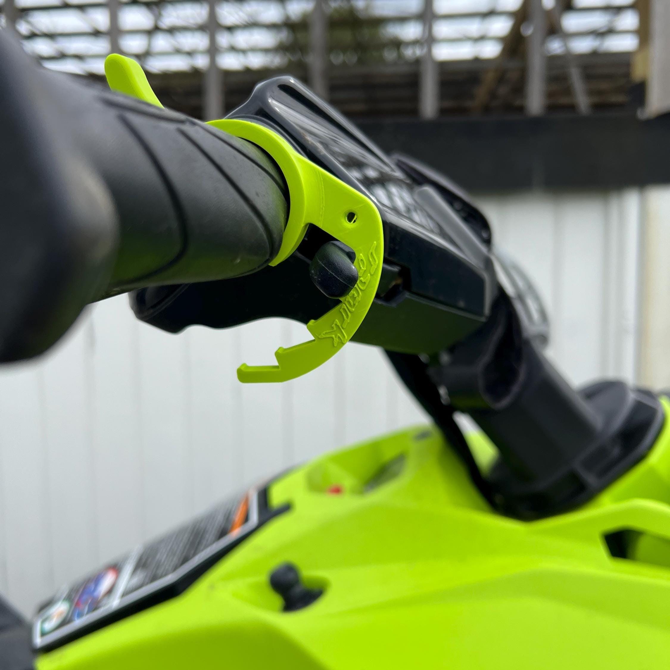 Lime green cruise control lever installed on a Sea-Doo Spark throttle
