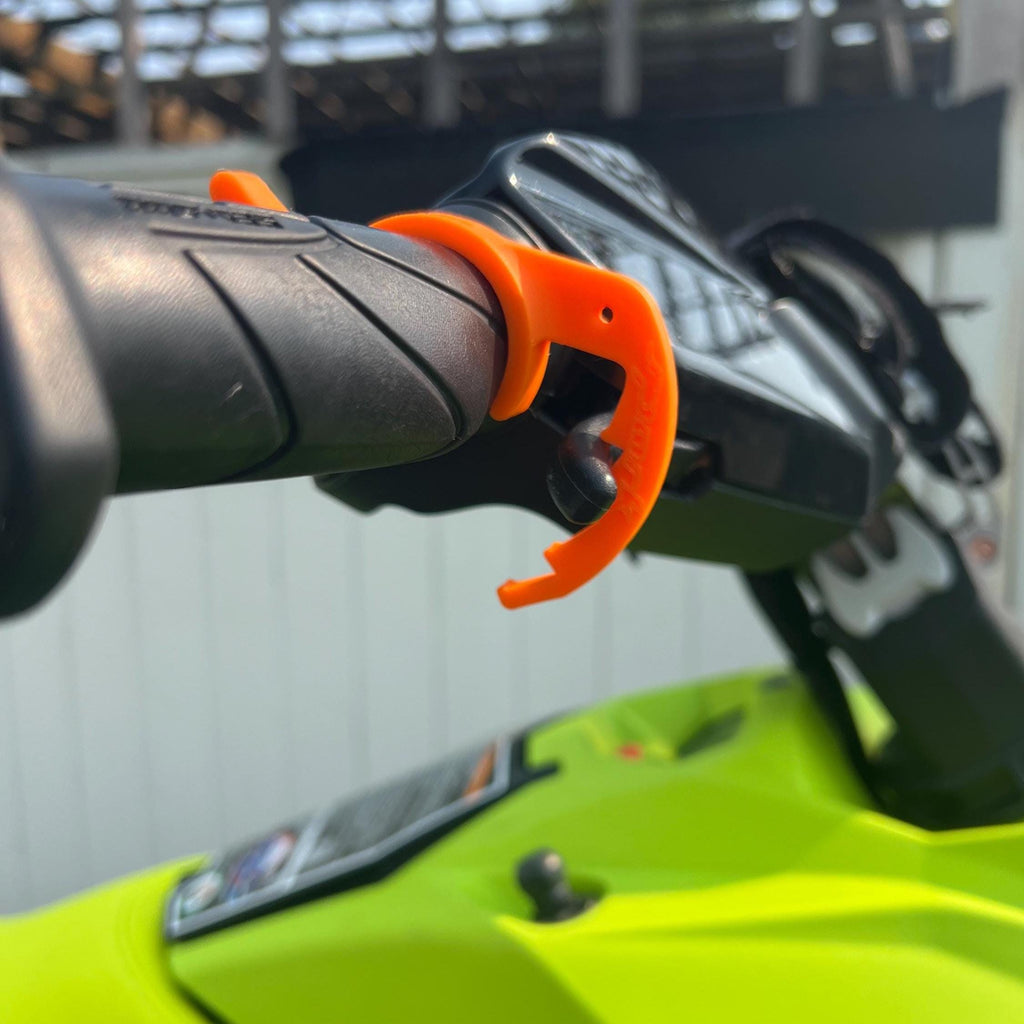 Orange cruise control lever installed on a Sea-Doo throttle grip