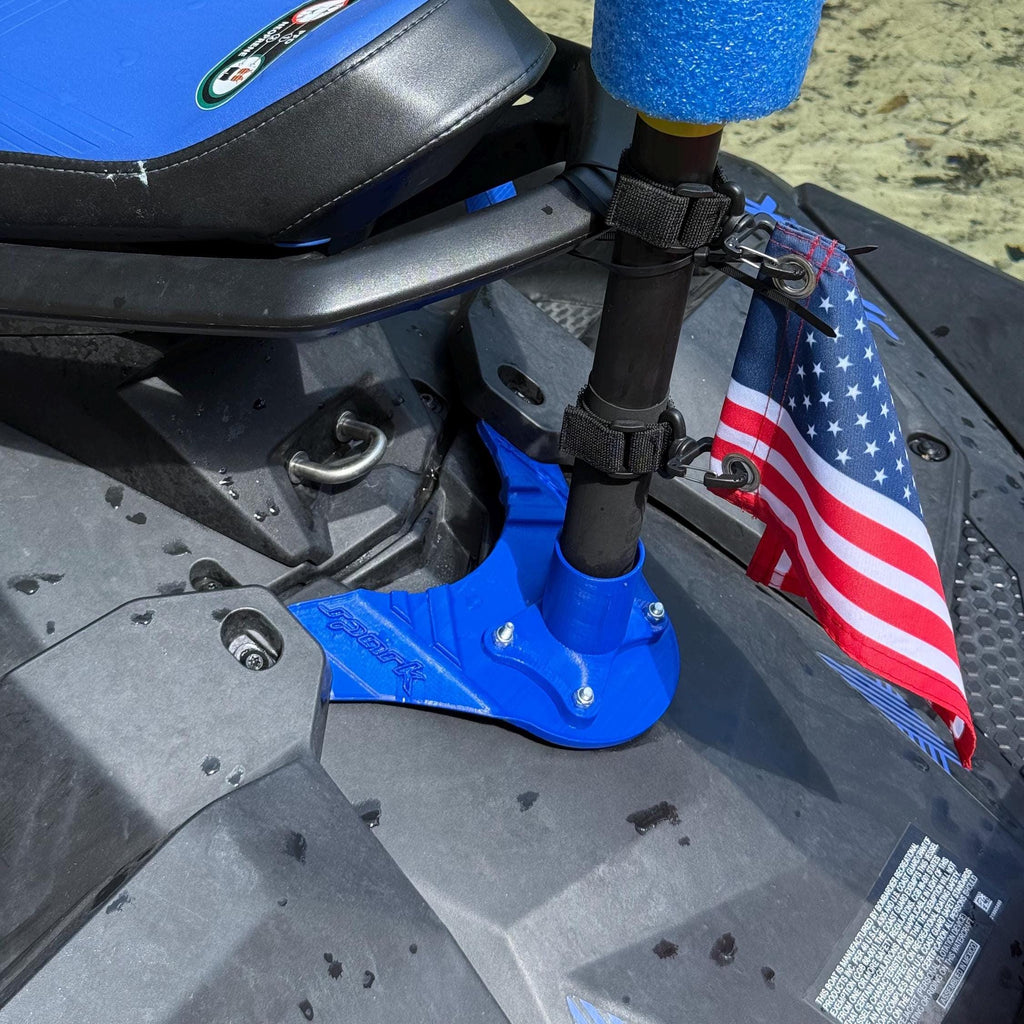 Close-up of the mount installed near the seat with a pole secured by straps and a US flag attached