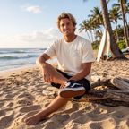 Man wearing the SparkyCA Designs Classic Crewneck Tee in Blonde, beach lifestyle photo with surfboards