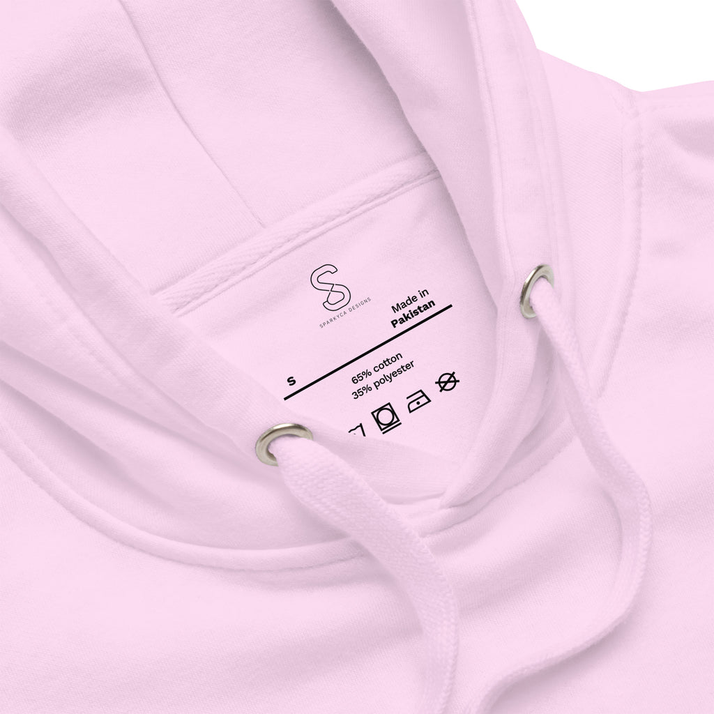 Close-up of the Lavender hoodie's inner neck label showing the SparkyCA Designs logo, size, and made-in-Pakistan fabric tag
